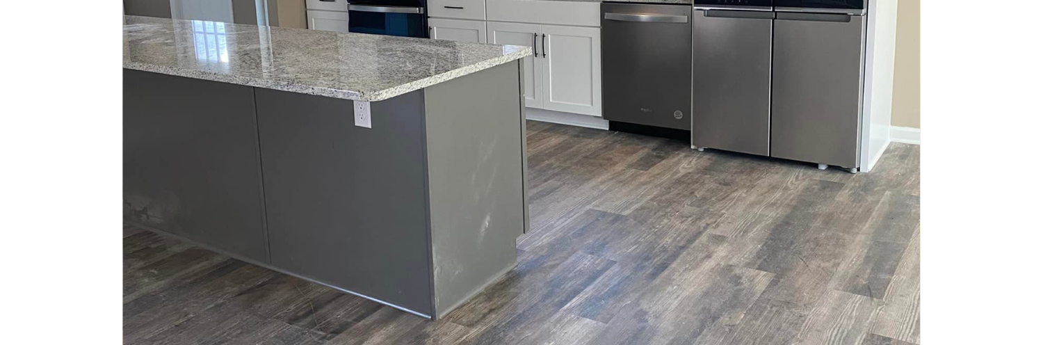 beautiful soft grey laminate flooring in a kitchen 
